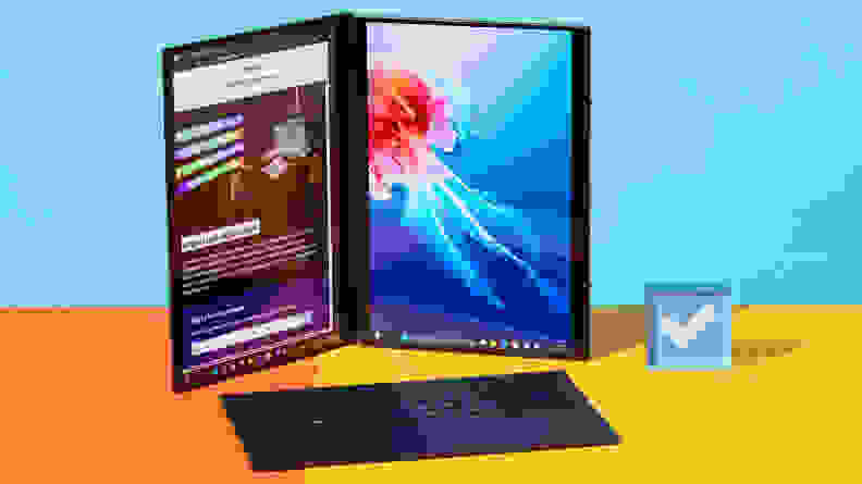 Dual screens of the 2024 Asus Zenbook Duo laptop folded upright and sitting next to keyboard and stylus pen.