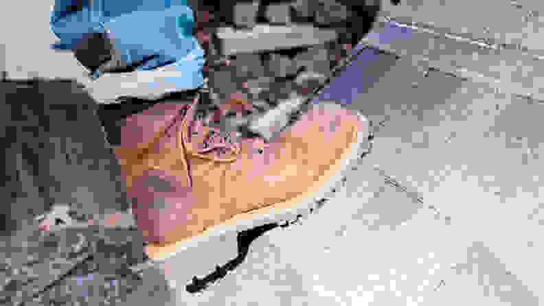 Our winner for the best work boot, the Chippewa 55025 Hador Steel Toe Boots, being worn on a shingled rooftop.