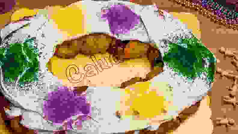 A photo of Claudia's King Cake with festive sprinkles, shot from above.