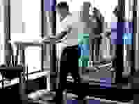 A man using an under-desk treadmill.