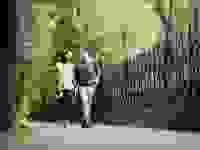 man and woman walk on pavement
