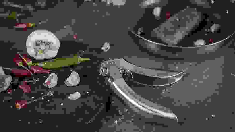 Close-up of a Kuhn Rikon garlic press.