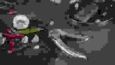 Close-up of a Kuhn Rikon garlic press.