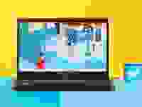 The MSI Modern 15 (2023) in black on a blue and yellow background next to a Reviewed checkmark.