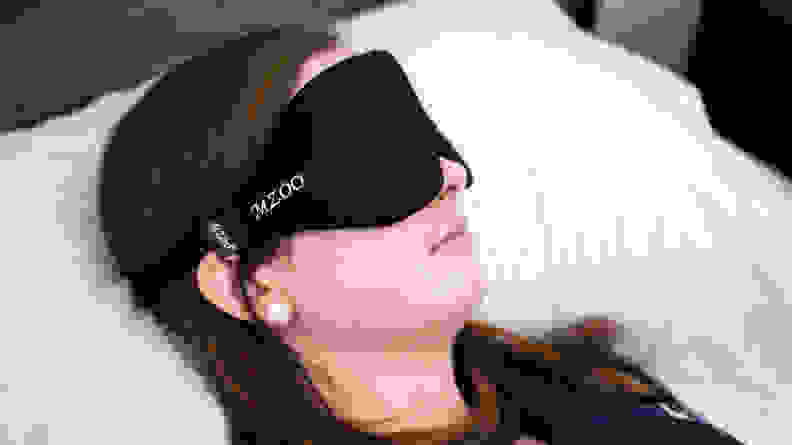 Sara sleeping in a black mzoo mask