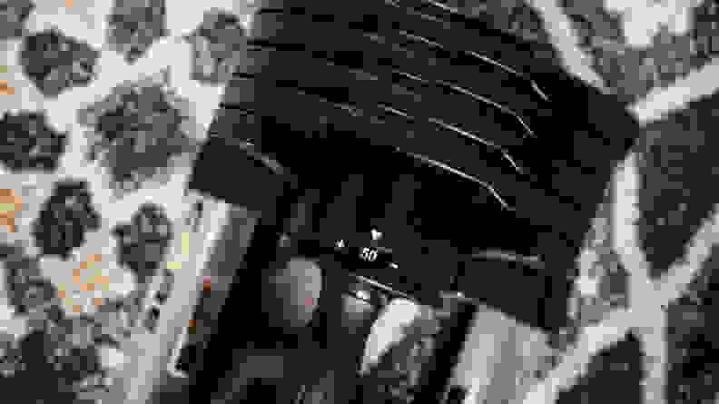 A close-up of a Core Home Fitness adjustable dumbbell