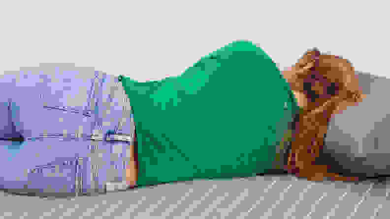 A person lying on their side on the Siena Memory Foam mattress.