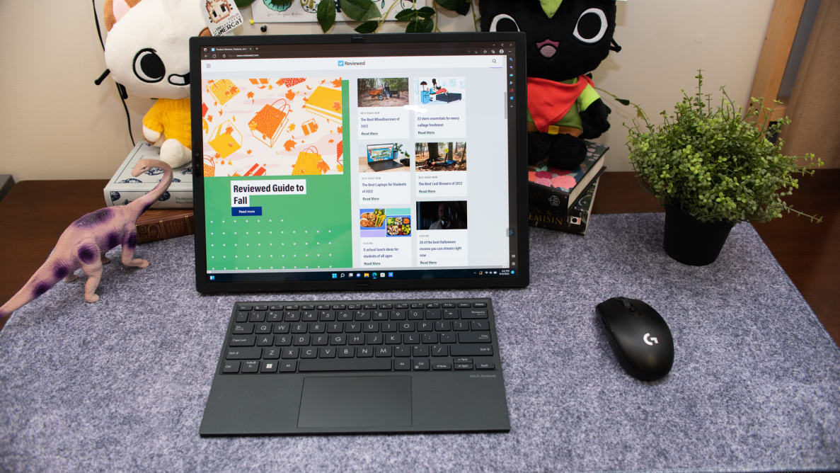 Asus Zenbook Fold 17 folded tablet-style in front of keyboard.