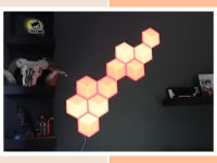 Govee Hexagon Lights mounted on wall in living room next to book case.