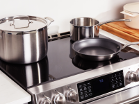 Stainless-steel and nonstick induction-compatible cookware on a Café induction range.