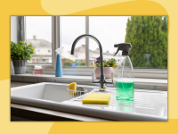 A set of cleaning supplies next to a kitchen sink