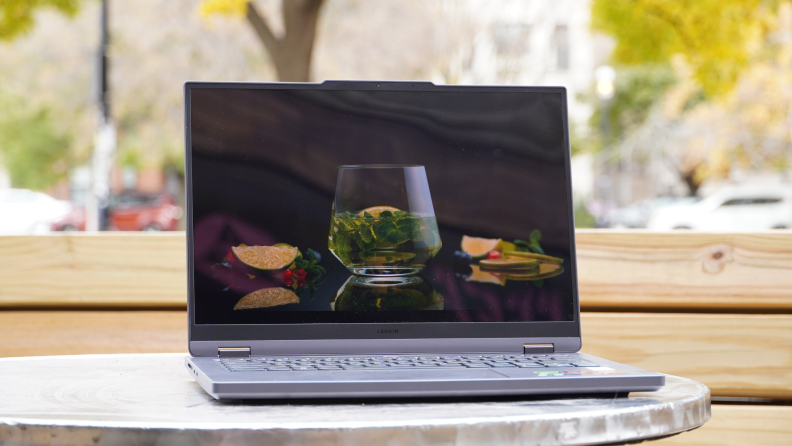 The Lenovo Legion Slim 5 14APH8 laptop open on a desk.