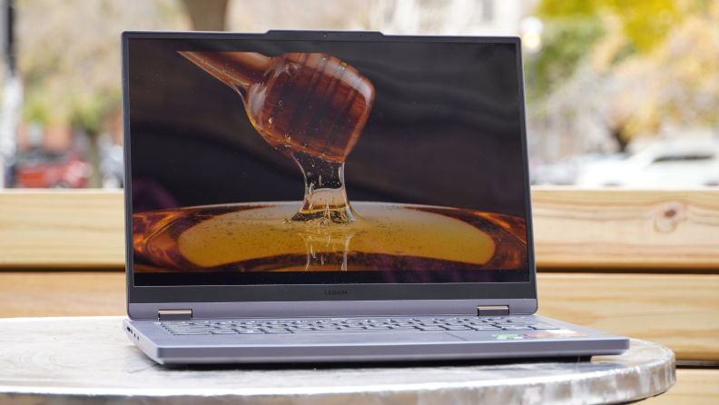 The The Lenovo Legion Slim 5 laptop on a table.